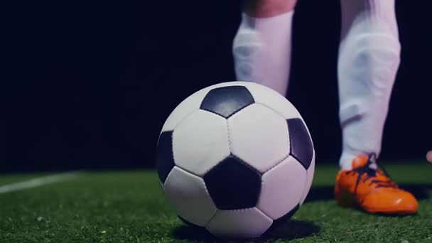 Professional soccer player putting his boot on the ball, 4k slow motion