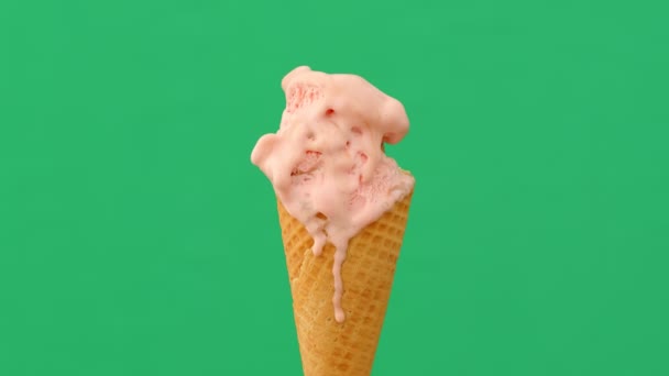 Time-lapse tání zmrzliny kužel na zeleném pozadí, 4K