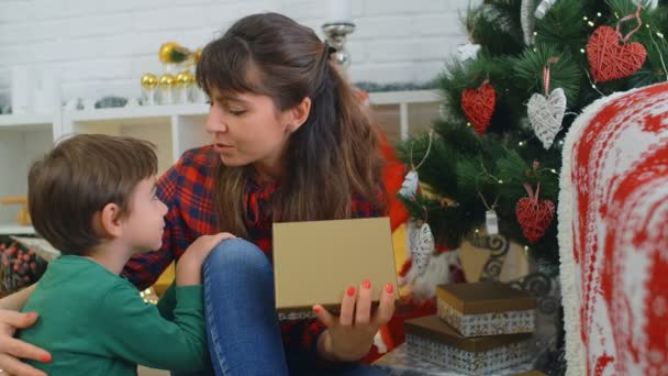 Christmas Gifts Concept Little Boy Gives His Mother Christmas Present — Stock Video