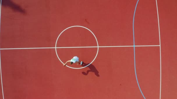 Drone Shot Unrecognizable Guy Practices His Basketball Moves — Stock Video