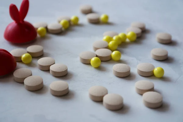 Medicine: food supplement, vitamins, pills - on a gray background
