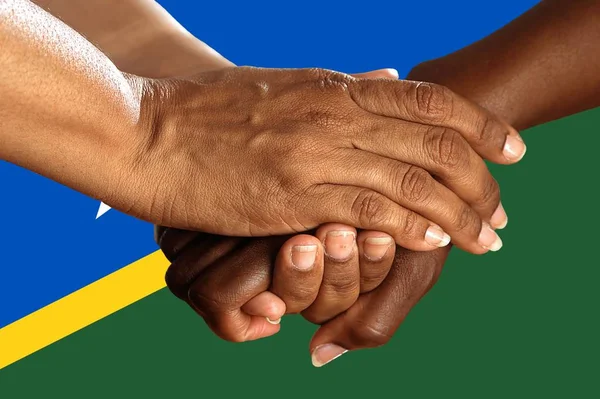 solomon islands flag, intergration of a multicultural group of young people.