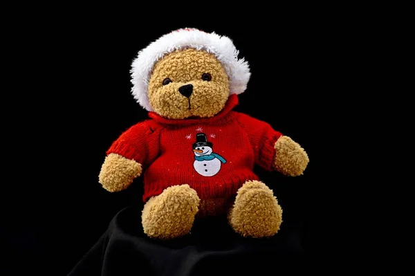 Little Santa Claus plush toy isolated on black background — Stock Photo, Image