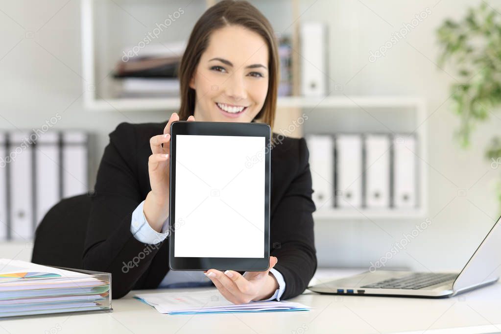Happy office worker showing to camera a tablet screen mockup
