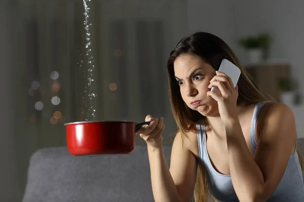 Furious woman claiming insurance for water leaks sitting on a couch in the living room at home