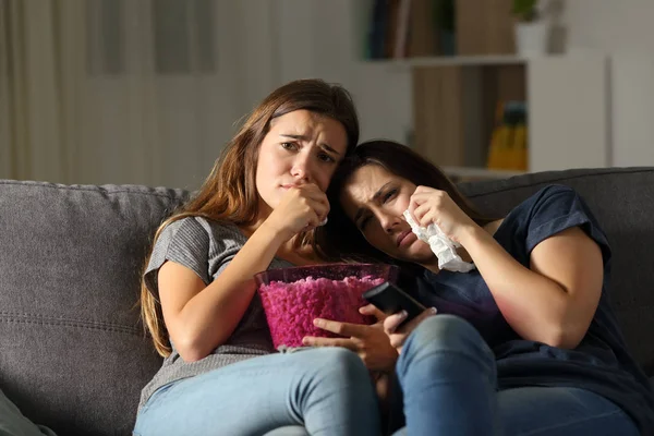 Two Sad Friends Crying Watching Night Sitting Couch Living Room — Stock Photo, Image