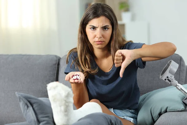 Angry Disabled Woman Holding Pills Thumbs Sitting Couch Living Room — Stock Photo, Image