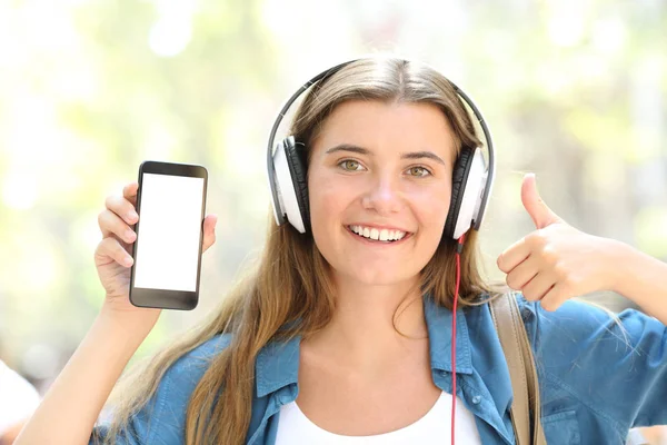 Front View Portrait Happy Girl Listening Music Showing Blank Smart — Stock Photo, Image