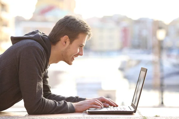 Side View Portrait Happy Teenage Boy Writing Laptop Vacation Royalty Free Stock Images