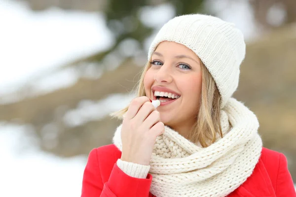 Happy Woman Applying Lip Balm Outdoors Winter Snowy Mountain — Stock Photo, Image