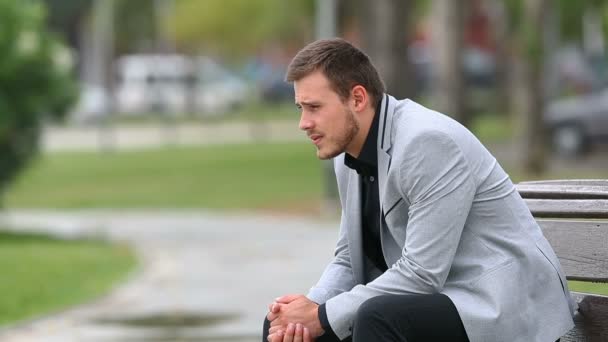 Side View Portrait Worried Businessman Sitting Bench Park — Stock Video