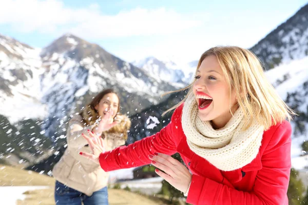 Two Funny Friends Joking Throwing Snowballs Mountain Winter Holiday — Stock Photo, Image