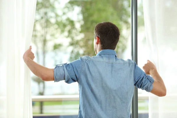 Back View Portrait Man Opening Curtains Looking Away Vindow Home — Stock Photo, Image
