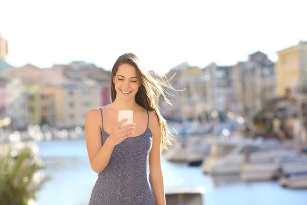 Front View Happy Woman Walking Vacation Using Smart Phone Coast — Stock Photo, Image