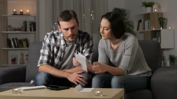 Sad Couple Complaining Reading Letter Night Sitting Couch Home — Stock Video