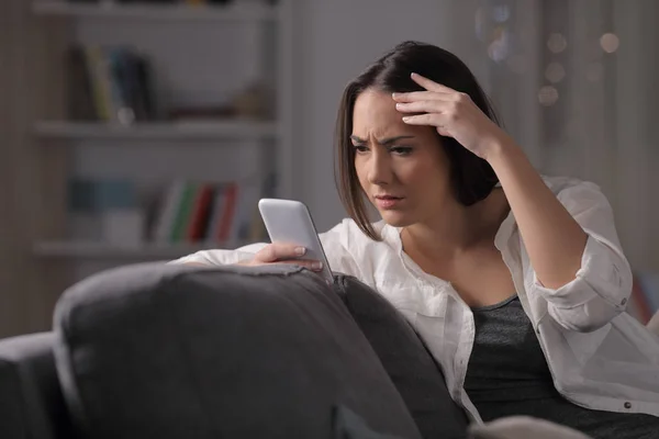 Worried Girl Checks Smart Phone Content Sitting Couch Night Home — Stock Photo, Image