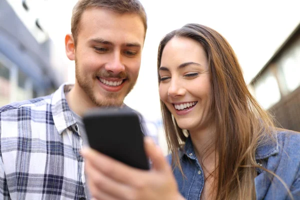 Front View Portrait Happy Couple Checking Smarphone Online Content Street — стоковое фото