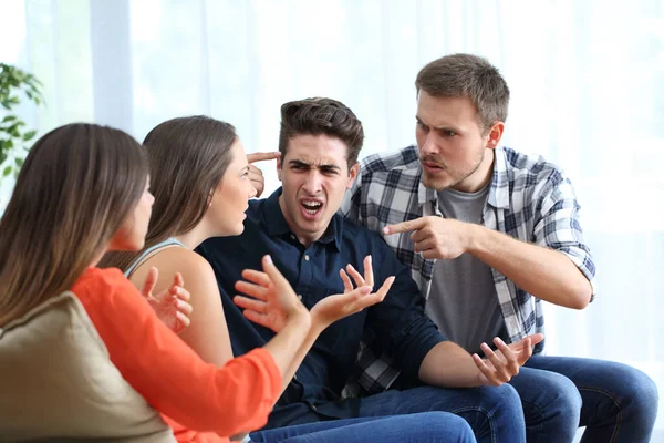 Four angry friends arguing at home — Stock Photo, Image