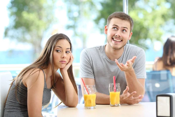 Bored girl listening a bad conversation from a friend or partner — Stock Photo, Image