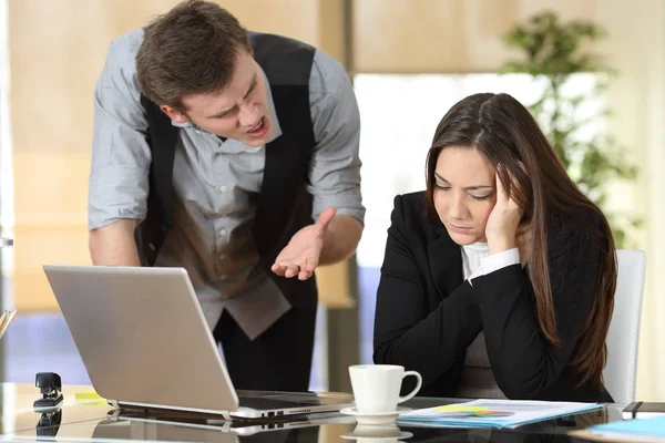 Businessman harassing at intern at office Stock Picture