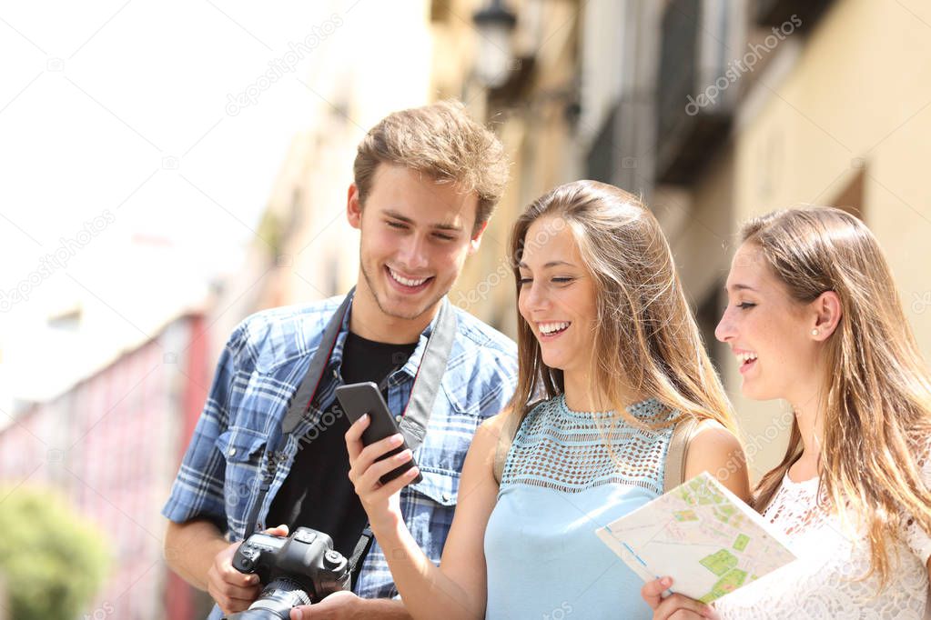Group of tourists locating using phone in the street