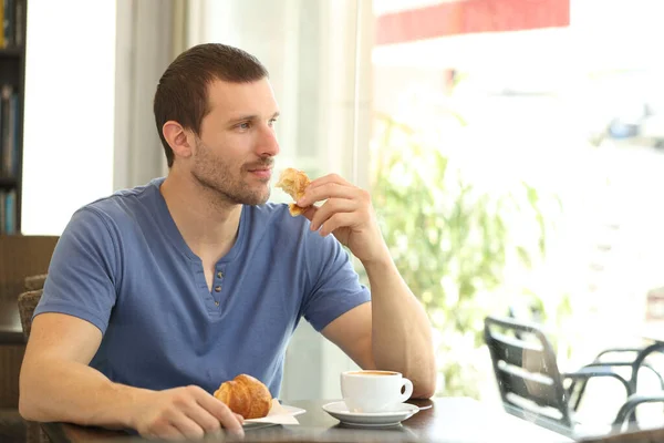 Pensive Man Having Breakfast Coffee Cup Croissant Looks Throw Window — Stock Photo, Image