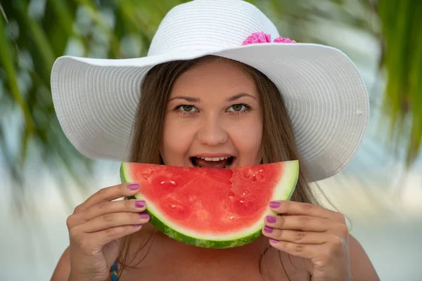 Girl with watermelon under palm tree — Stock Photo, Image