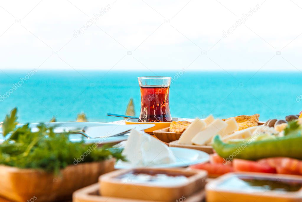 Breakfast on the beach at hotel or resort by the sea in summer season. Holiday and vacation breakfast image.