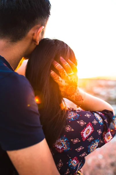 Young and happy asian couple hugging each other. Man or boy hugging his girlfriend. The girl\'s hand has henna. Asian couple love each other. Husband hug wife.