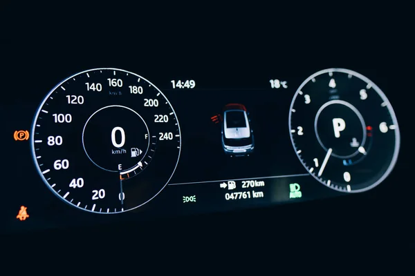 Modern car or automobile dashboard panel. Car HUD Speedometer instrument panel. Illuminated panel speed display car interior.
