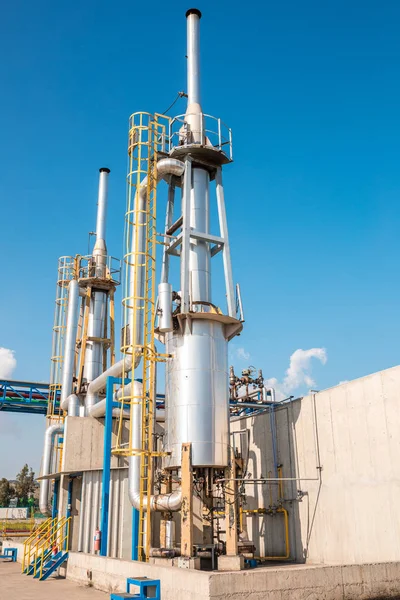 Chemical industry plant, factory or facility. Oil and gas refinery in factory. Steel Pipelines, tubes, containers and tanks in chemical plant. Industrial stainless steel chemical storage tanks or silo in factory or facility. Oil or fuel silo.