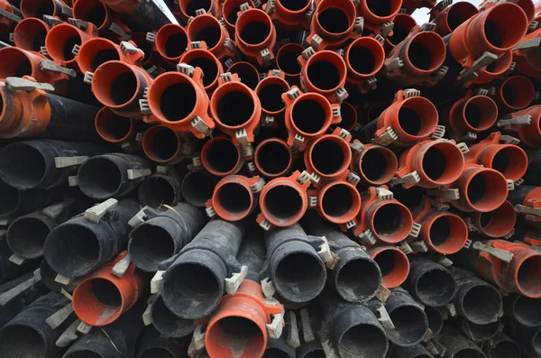 Large Group Stack Orange Black Plumbing Plastic Rubber Pipes Industrial — ストック写真