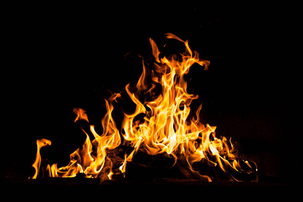 Fire flames isolated on black background. High resolution wood fire flames collection smoke texture background concept image.