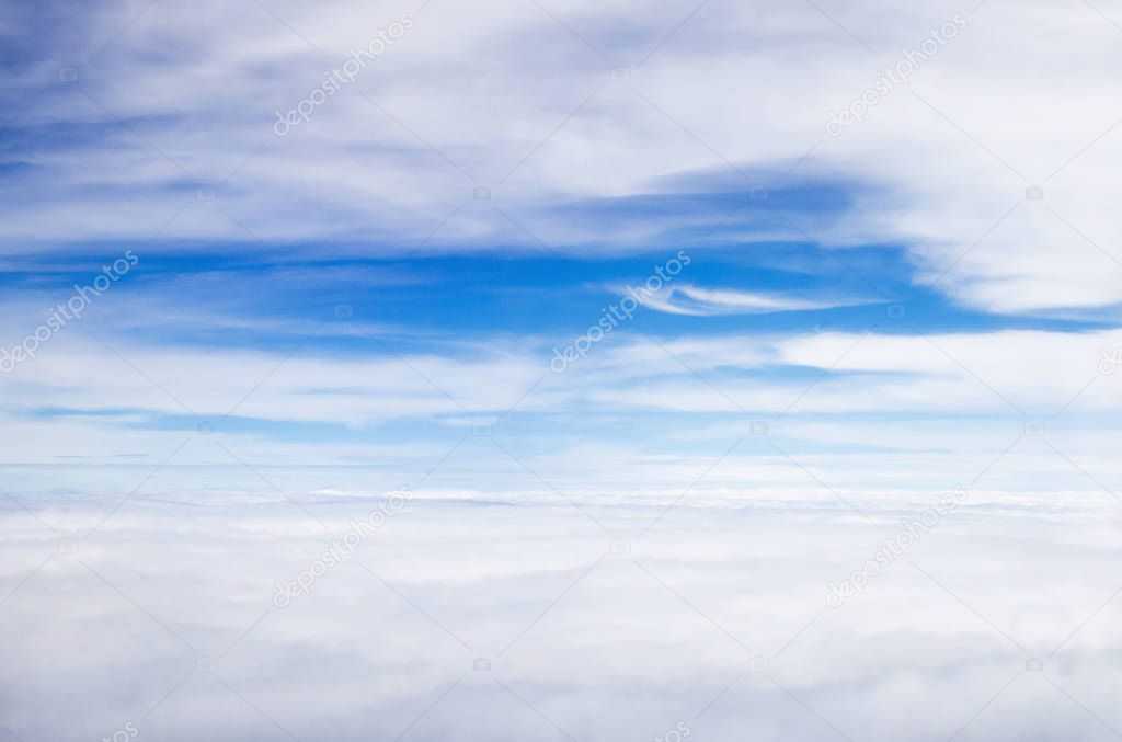Blue sky background with white clouds on Plane window view