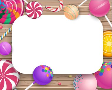 Ahşap arka plan üzerinde renkli lolipop ile beyaz çerçeve.