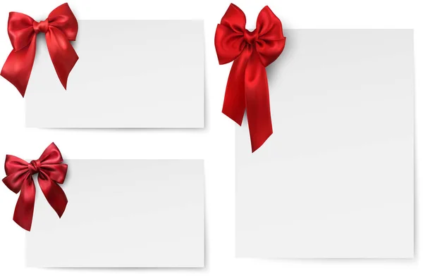 White paper cards with red satin bow. — Stock Vector