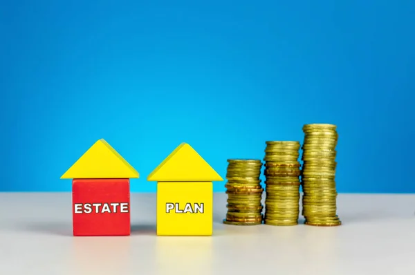 Real Estate Planning. Build a house from wood cubes with stacking coin. Real estate, investment, property planning concept or other your content.