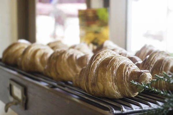 Fresh baked croissant for sale, stock photo