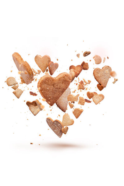Card with flying crisp biscuit in the shape of heart