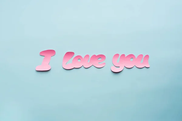 Words I love you from pink paper background — Stock Photo, Image