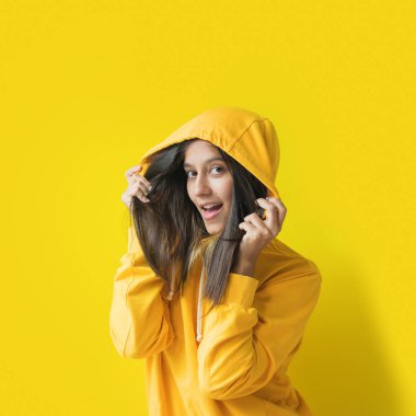 Funny girl yellow hood sweatshirt pose emotionally clipart
