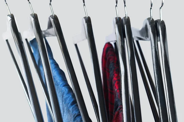 Red and blue color things on open clothes rail
