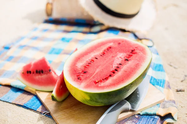 Summer picnic time on a beach. Fresh water melon — Stock Photo, Image