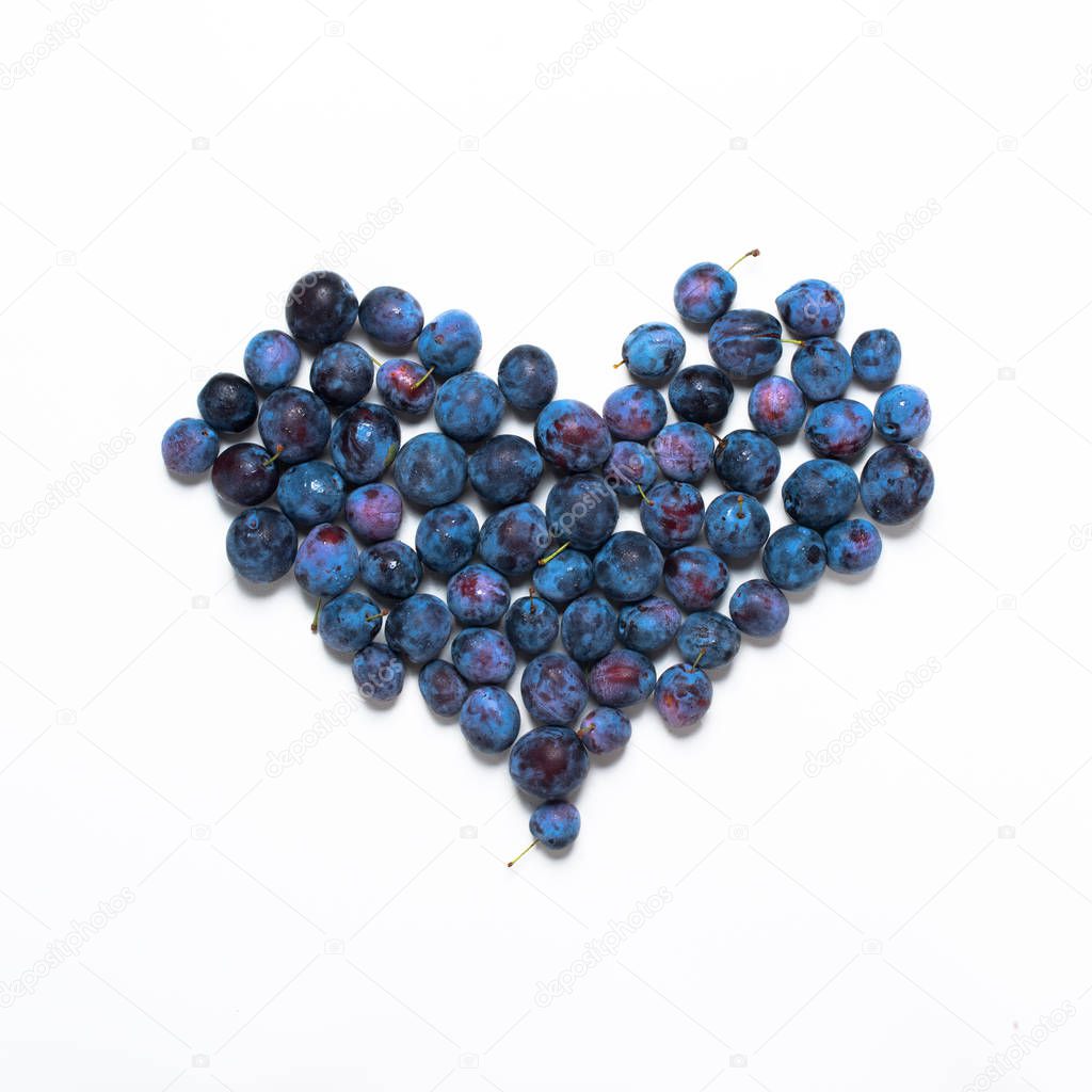 Blue damascenes lying shape heart isolated white