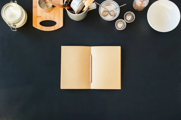 Empty Paper Blank Pages Notebook for Record Recipes Line Composition Tableware Preparation Cooking Kitchen Accessories Black Table Different Metal Dishes Ware Support Stuff Top View. Flat Lay Mock up
