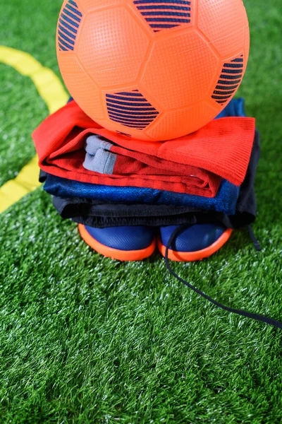 Orange Football Ball Uniform Shoes Green Field Kids Zone Screen — стоковое фото