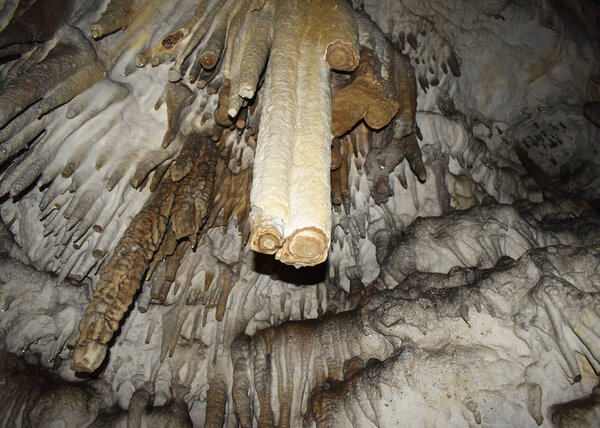 Big Azishskaya Cave in Adygea, Russia. Broken stalactite in section.