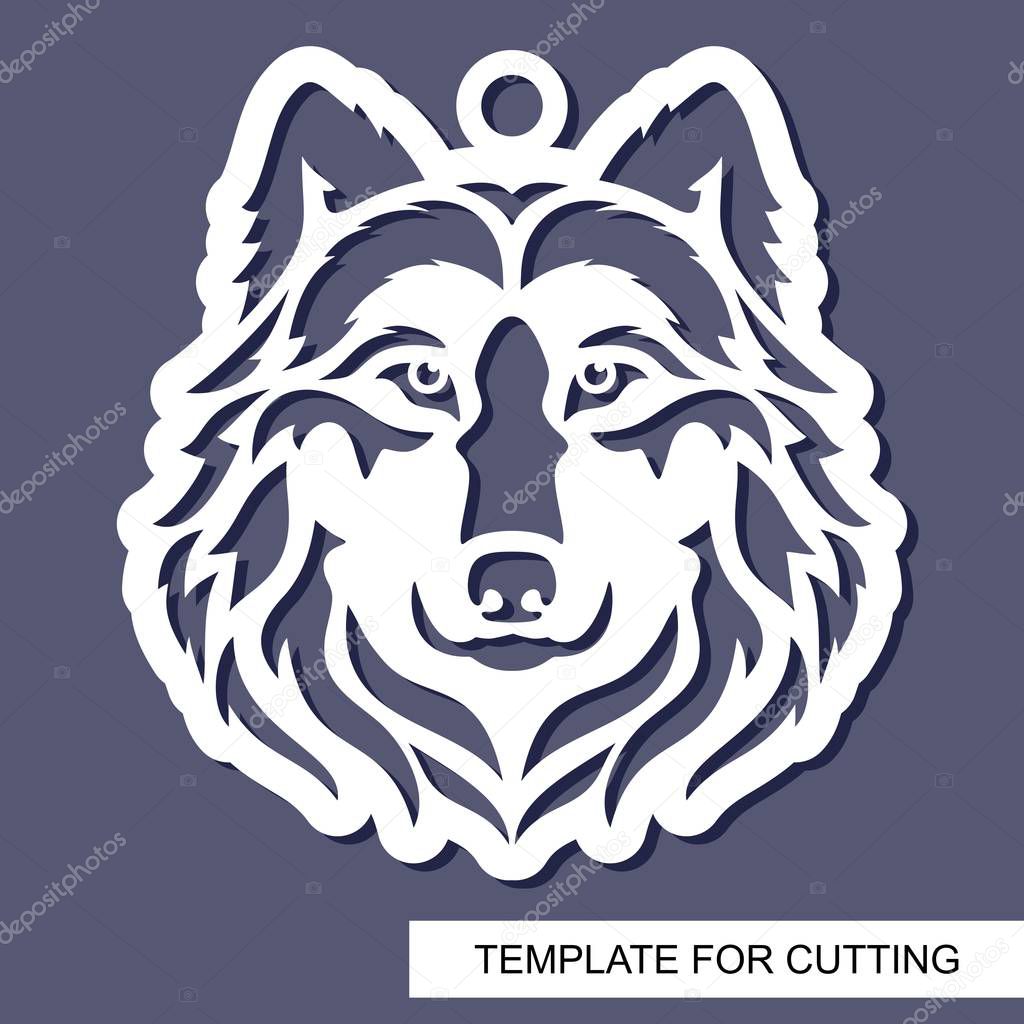 Wolf head silhouette. Hanging toy or pendant. White character on a grey background. Template for laser cutting, wood carving, paper cut or printing. Vector illustration.