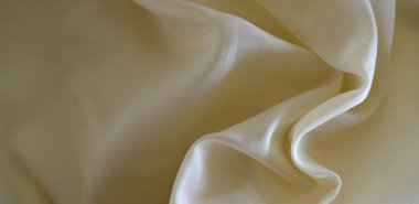 Pürüzsüz altın rengi ipek düğün arkaplanı olarak kullanılabilir. Sepia tonunda. Retro biçimi