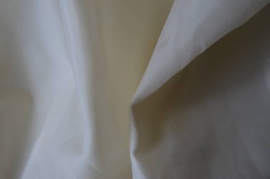 Pürüzsüz altın rengi ipek düğün arkaplanı olarak kullanılabilir. Sepia tonunda. Retro biçimi